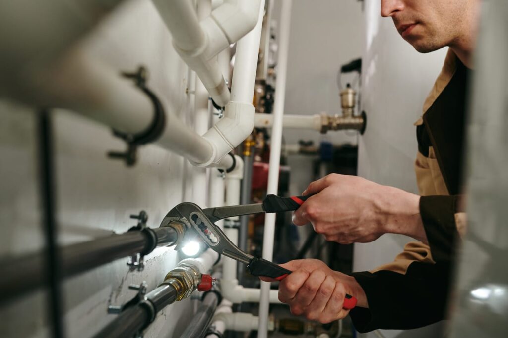 Plumbers maintaining commercial plumbing pipes in Menifee